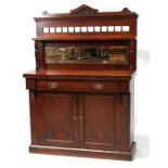 A Victorian walnut chiffonier, the mirrored back above a single frieze drawer, 108cms (42.5ins)