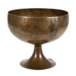 A Persian 12th century khorassan bronze footed bowl, engraved to the rim with kufic script in