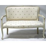 A white painted upholstered two-seater sofa, 120cm (47.25ins) wide.