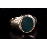 A 9ct gold bloodstone set signet ring. Approx Uk size T 1/2