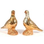 A pair of Chinese gilded porcelain pigeons, impressed marks to base, 18cms (7ins) high. Condition