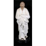 A Chinese Republic Period Ge type pottery figure of a scholor, on a later pierced hardwood stand,