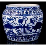 A Chinese blue & white jardiniere decorated with fish and flowers, 17cms (6.75ins) high. Condition