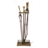 Three Georgian brass & steel fire irons and associated Georgian brass stand (4).