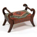 A Victorian mahogany footstool, with tapestry upholstered seat, 39cms (15.75ins) wide.