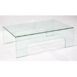 A modern design curved glass coffee table, 110 (43.25ins) wide.