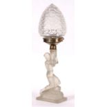 An Art Deco frosted glass table lamp in the form of a naked lady, 42cms (16.5ins) high.