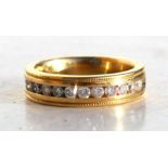 An 18ct gold diamond set half eternity ring, UK size 'J'. Condition Report Weight 7.5g overall.