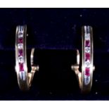 A pair of 14ct gold diamond & ruby hoop earrings.