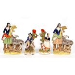 A pair of Staffordshire figures of a young girl holding a wheatsheaf with a goat by her side;