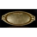 A large Art Nouveau brass oval tray, with scroll handles, 72cms (28.25ins) wide.