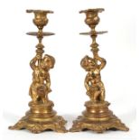 A pair of 19th century bronze figural candlesticks, 26cms (10.25ins) high.