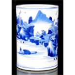 A Chinese blue & white cylindrical form brush pot, decorated with figures in a mountainous scene,