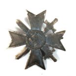 A Third Reich War Merit Cross with Swords 1st class. Marked L15 to the reverse of the pin
