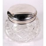 A continental silver topped oversized cut glass dressing table jar, 12.5cms (5ins) high.