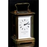 A brass carriage time piece, the white enamel dial with Roman numerals, signed 'Matthew Norman,