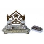 A brass desk stand with two cut glass inkwells; together with a travelling inkwell.