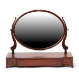 An Edwardian mahogany toilet mirror with central long drawer flanked by two short drawers, 74cms (