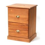A modern pine two-drawer filing chest, 59cms (23.25ins) wide.