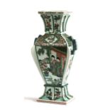 A Chinese famille rose square section vase, decorated with figures and prunus, six character mark to