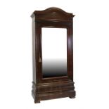 A 19th century French mahogany armoire with mirrored door enclosing a shelved interior, with two