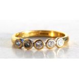 An 18ct gold five-stone diamond ring, UK size approx 'N / O'. Condition Report Weight 3g overall.