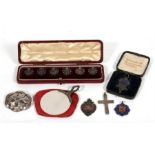 A boxed set of six silver filigree buttons; a silver brooch; a silver crucifix; a silver mirror; and