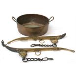A large 19th century brass two-handled jam pot; together with a pair of brass mounted horse hames (