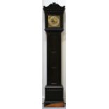 An 1920's oak cased long case clock with brass dial and silvered chapter ring, the dial with Roman