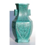 A Chinese vase of hexagonal form, with incised decoration on a turquoise ground, four-character