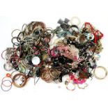 A large quantity of costume jewellery including rings, bracelets and necklaces.