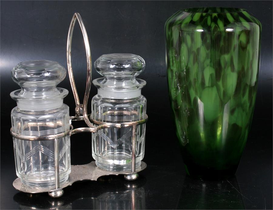 A mottled green Art Glass vase, 23cms (9ins) high; together with a two-bottle condiment set on