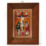 A Limoges enamel plaque depicting the Crucifixion, framed, 9 by 13cms (3.5 by 5.1ins).