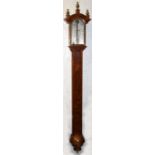 An O.Comitti & Son stick barometer in burr walnut case, 105.5cms (41.5ins) long.