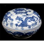 A large Chinese blue & white covered bowl decorated with dragons chasing flaming pearls, with six