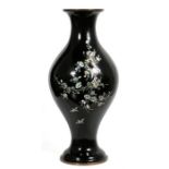 A Korean enamel vase decorated with mother of pearl inlay on a black ground, 41cms (16ins) high.