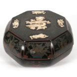 A Chinese lacquered box & cover of octagonal form, with applied ivory dragon decoration, 28cms (