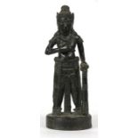 A south east Asian bronze figure of a warrior, 20cms (8ins) high.