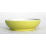 A small shallow Chinese yellow ground saucer dish, with under glaze blue seal mark to the underside,