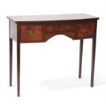 A mahogany bow-fronted side table with central frieze drawer flanked by two short drawers, on square