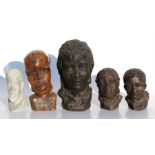 Three metal African busts; a carved hardwood bust of a man and a similar soapstone bust (5).
