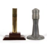 A trench art style brass table lighter on a wooden base 13cms high (5ins) and an aluminium table