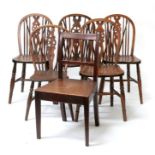 A mixed group of five wheel back chairs; together with a Georgian mahogany hall chair (6).