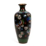 A Japanese cloisonne vase decorated with butterflies and flowers on a black ground, 18cms (7ins)
