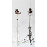 Two Art Nouveau wrought iron and copper telescopic standard lamps.