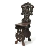 A 19th century carved walnut hall chair.