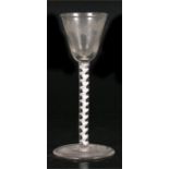 A 19th century air twist stem wine glass, etched with grapes & vines, 14cms (5.5ins) high. Condition