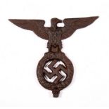 A reproduction cast iron Nazi Third Reich finial Eagle with Swastika 19.5cms wingspan by 17cms