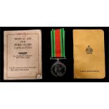 A WW2 Defence Medal with a booklet Medical Aid for Home Guard Casualities and an Active Service