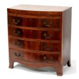 A figured mahogany bowfront chest, with brushing slide above four long graduated drawers, 76cms (